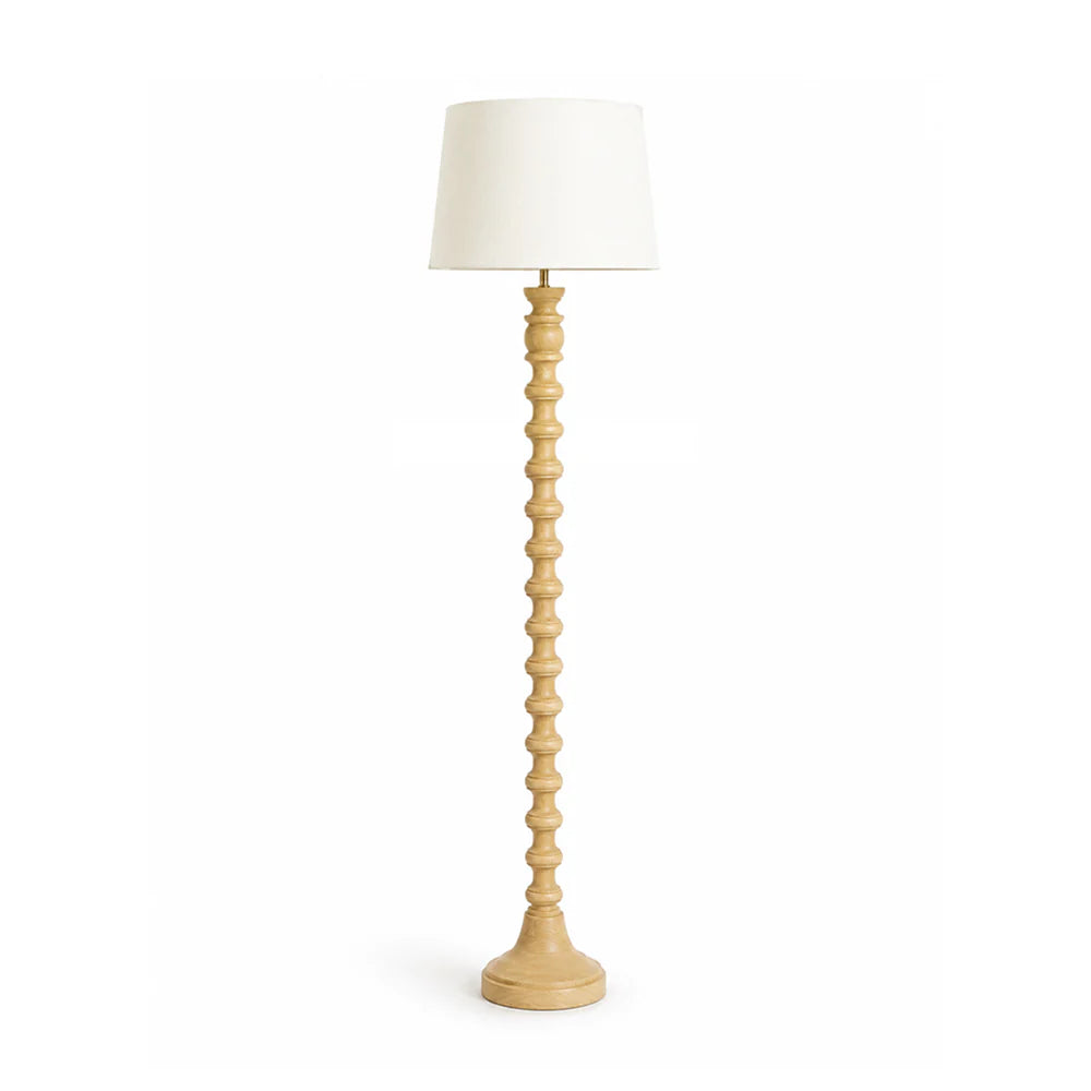 Floor lamp with wooden base and white shade on a white background