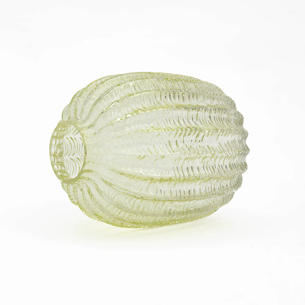 A ribbed, textured glass vase in a pale yellow-green color, photographed on a seamless white background.